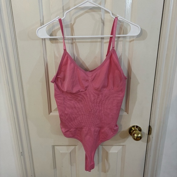 Tops - pink bodysuit looking for best offer